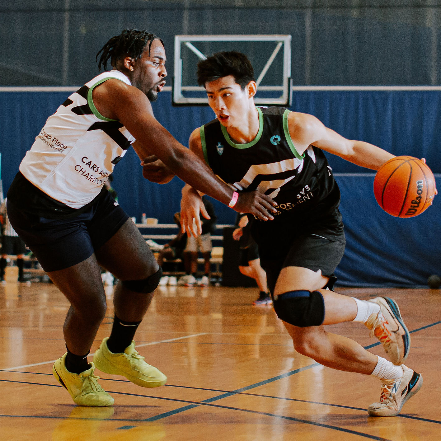 Basketball players wearing a sublimated jersey printed by us at Coastal Reign