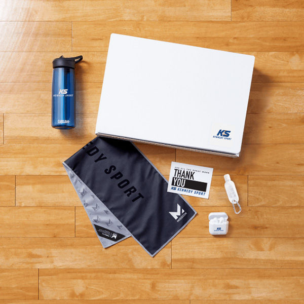 An image of a swag box gift curated for a sports company with their logo printed on the products.