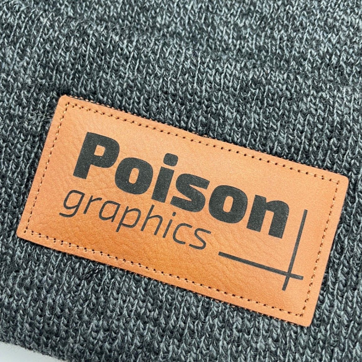 A close up image of a custom leather patch toque that we printed for a customer.