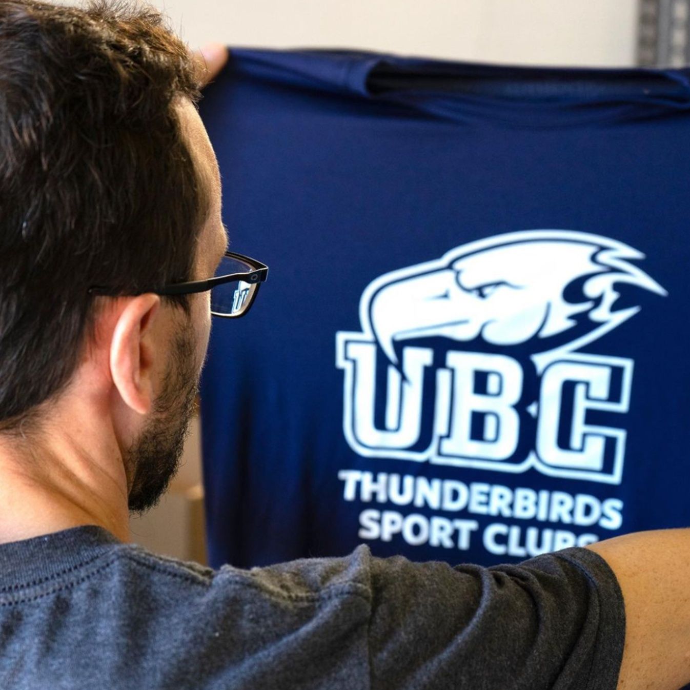 A polyester t-shirt with a screen-printed design on it for UBC.