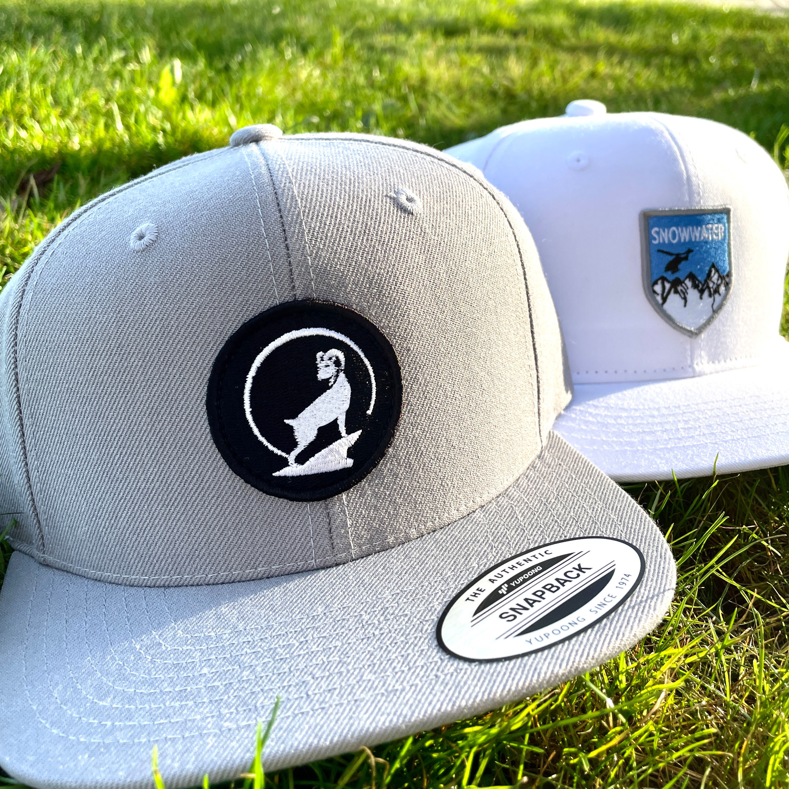 An image of custom trucker hats that were printed using embroidery patches.