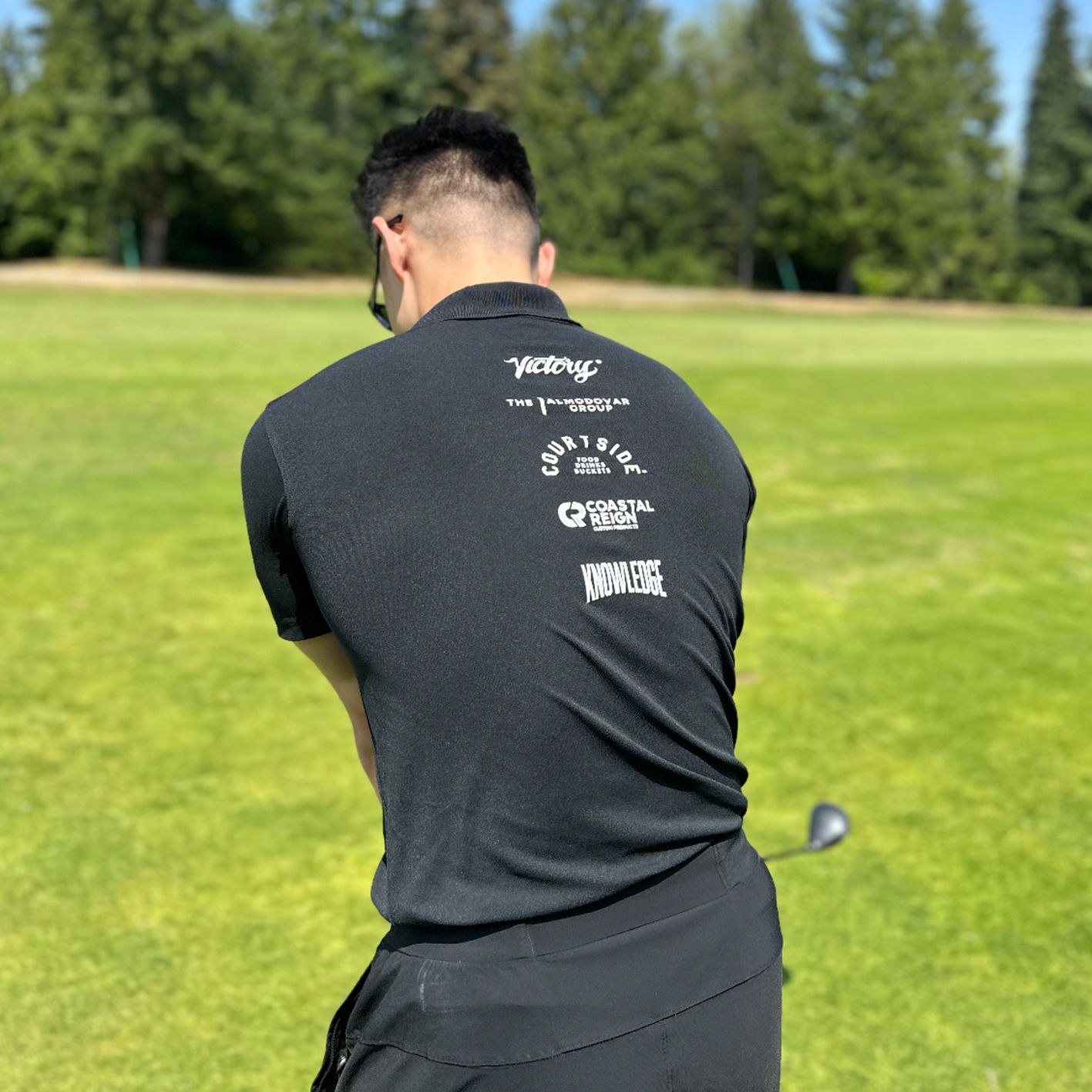 Screen printed design on the back of a polyester polo shirt.