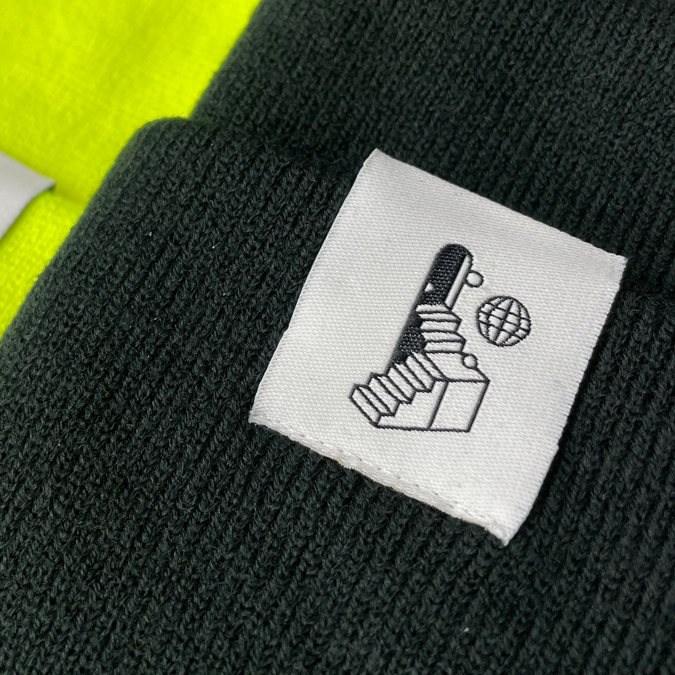 An image of a woven label attached to a toque.