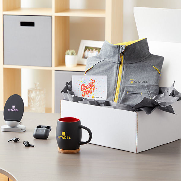 An employee's anniversary gift box customized with the company's logo.