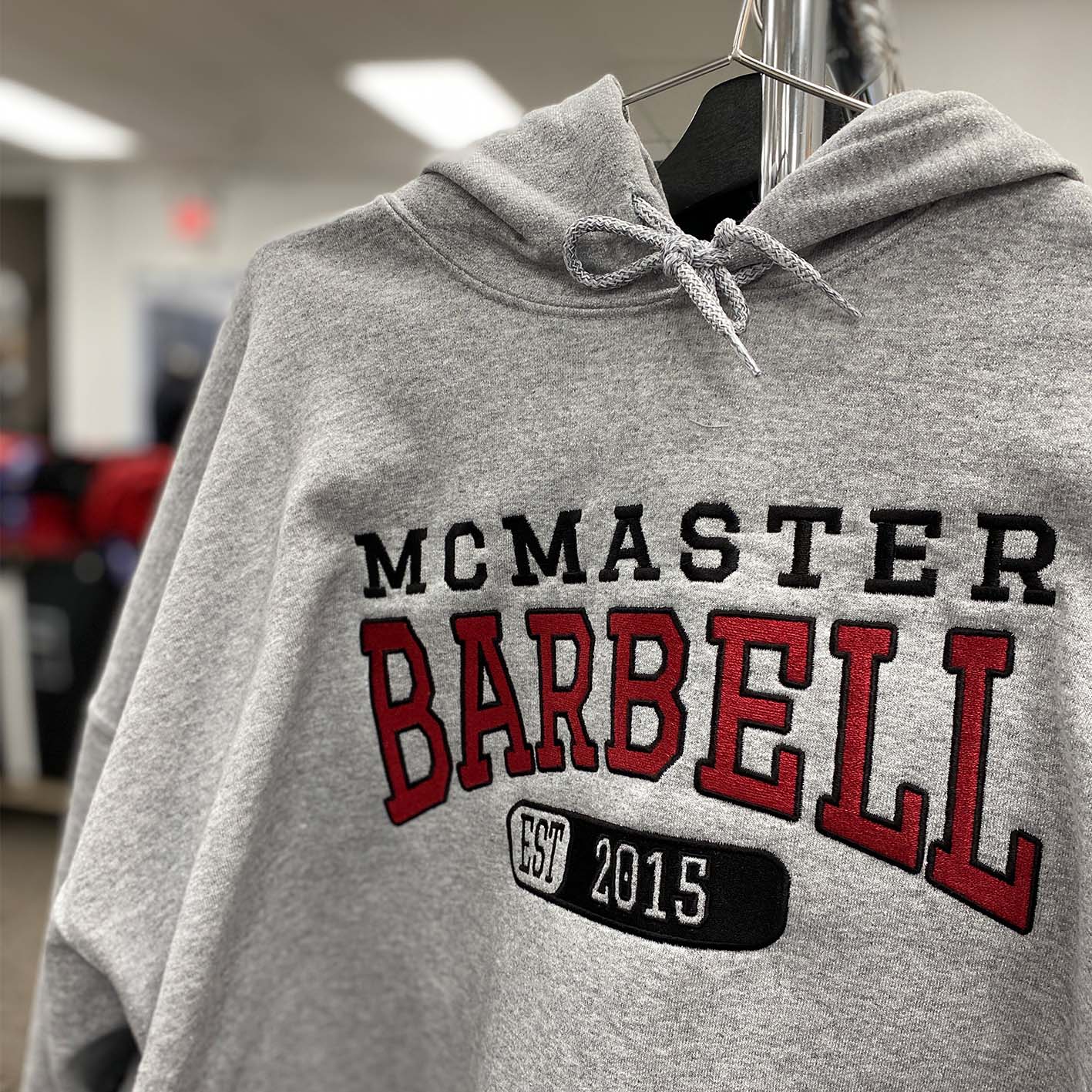 McMaster Barbell embroidered onto a hoodie