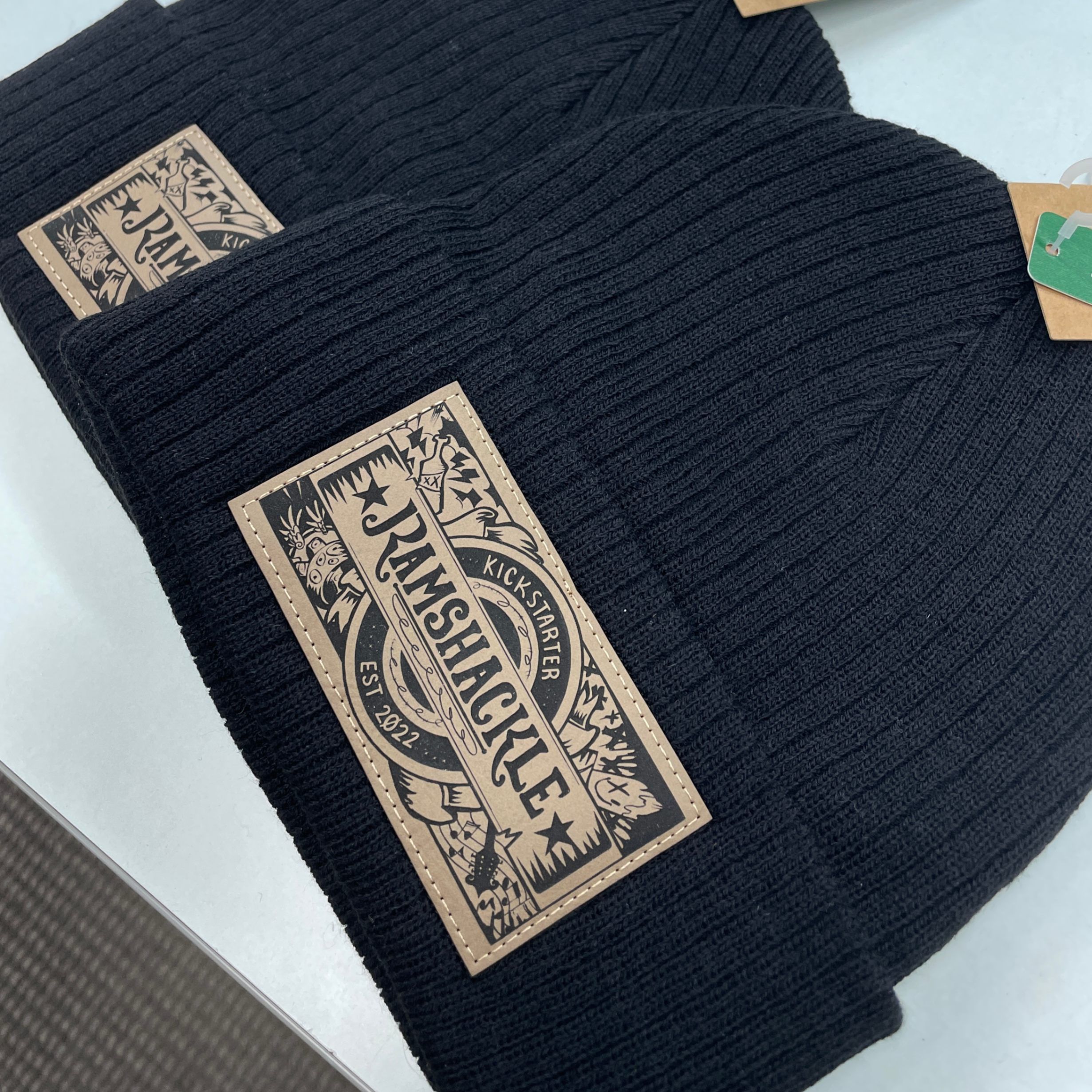 An image of custom leather patch toques that we printed for an animation team!