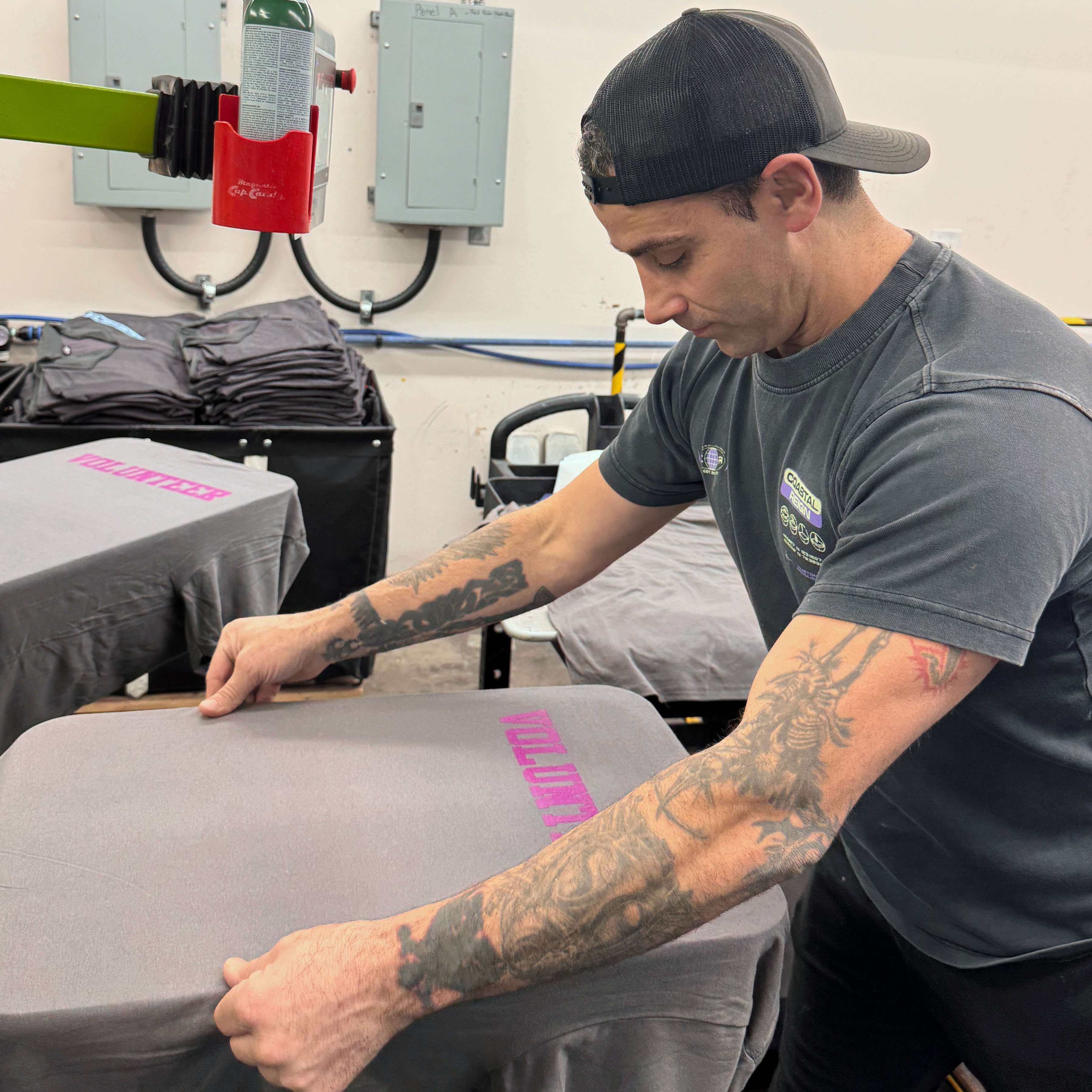 An image of our team screen printing
