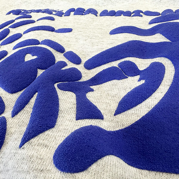 A close up example of a 3d puff screen printed shirt.