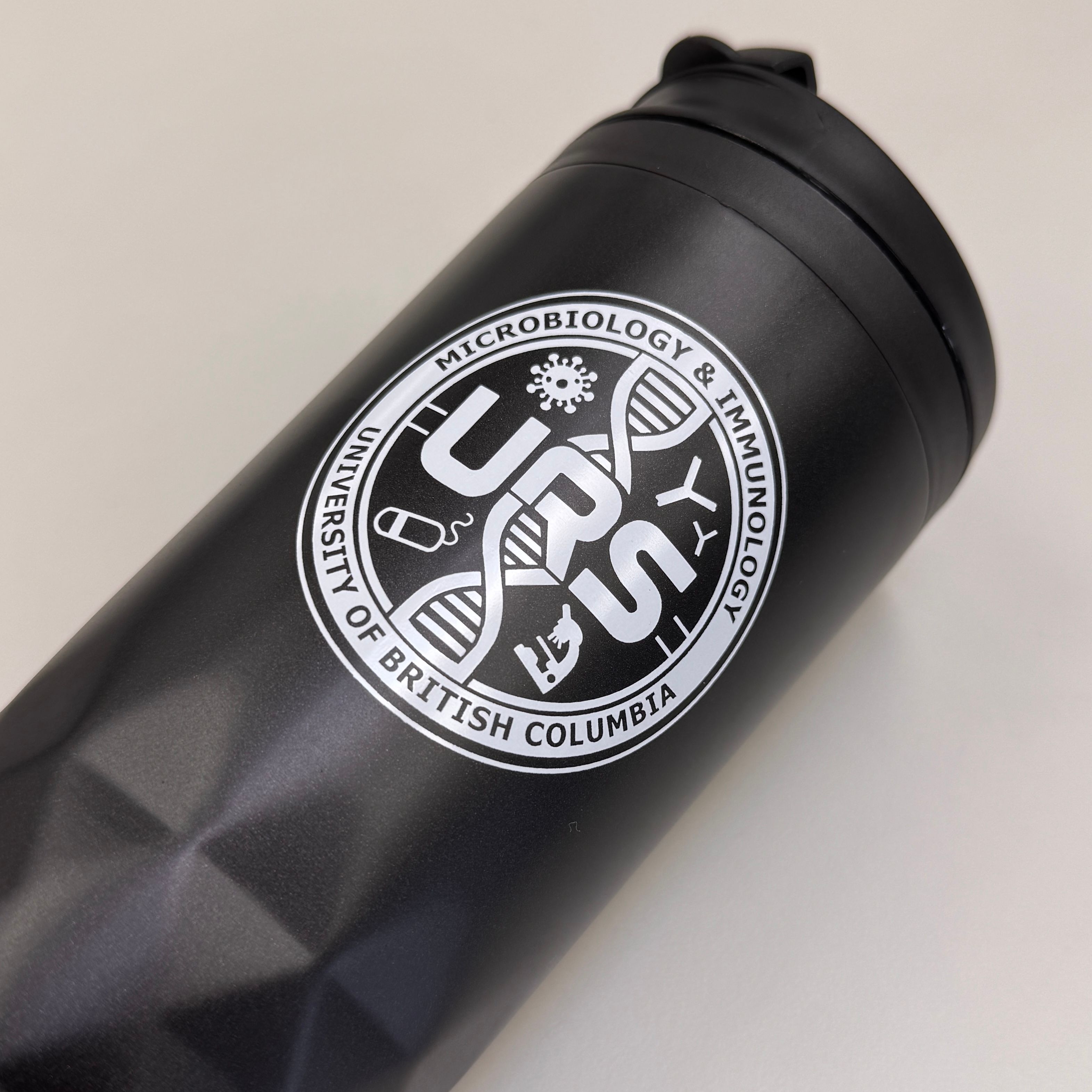 A screen printed design for UBC on a tumbler