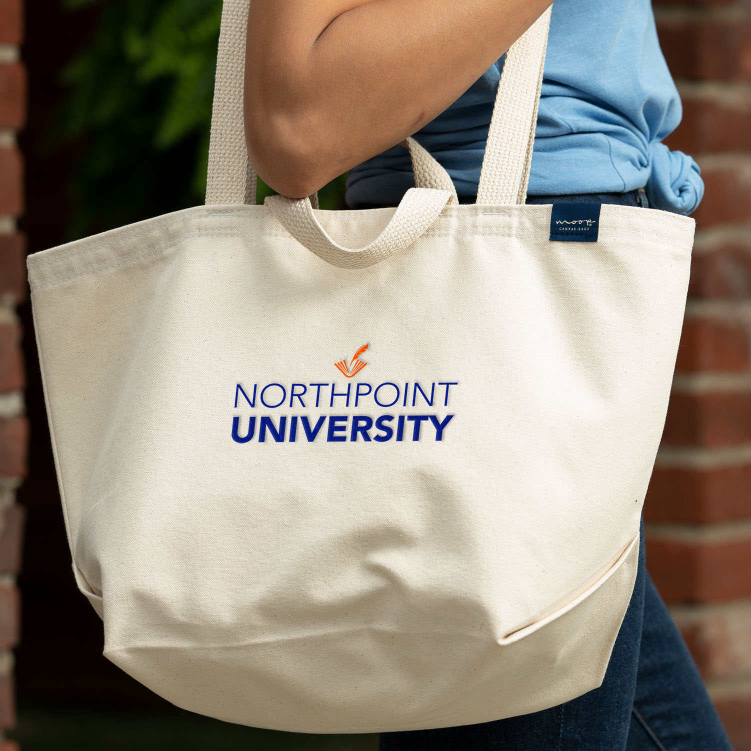 A printed design for a university on a shopping bag
