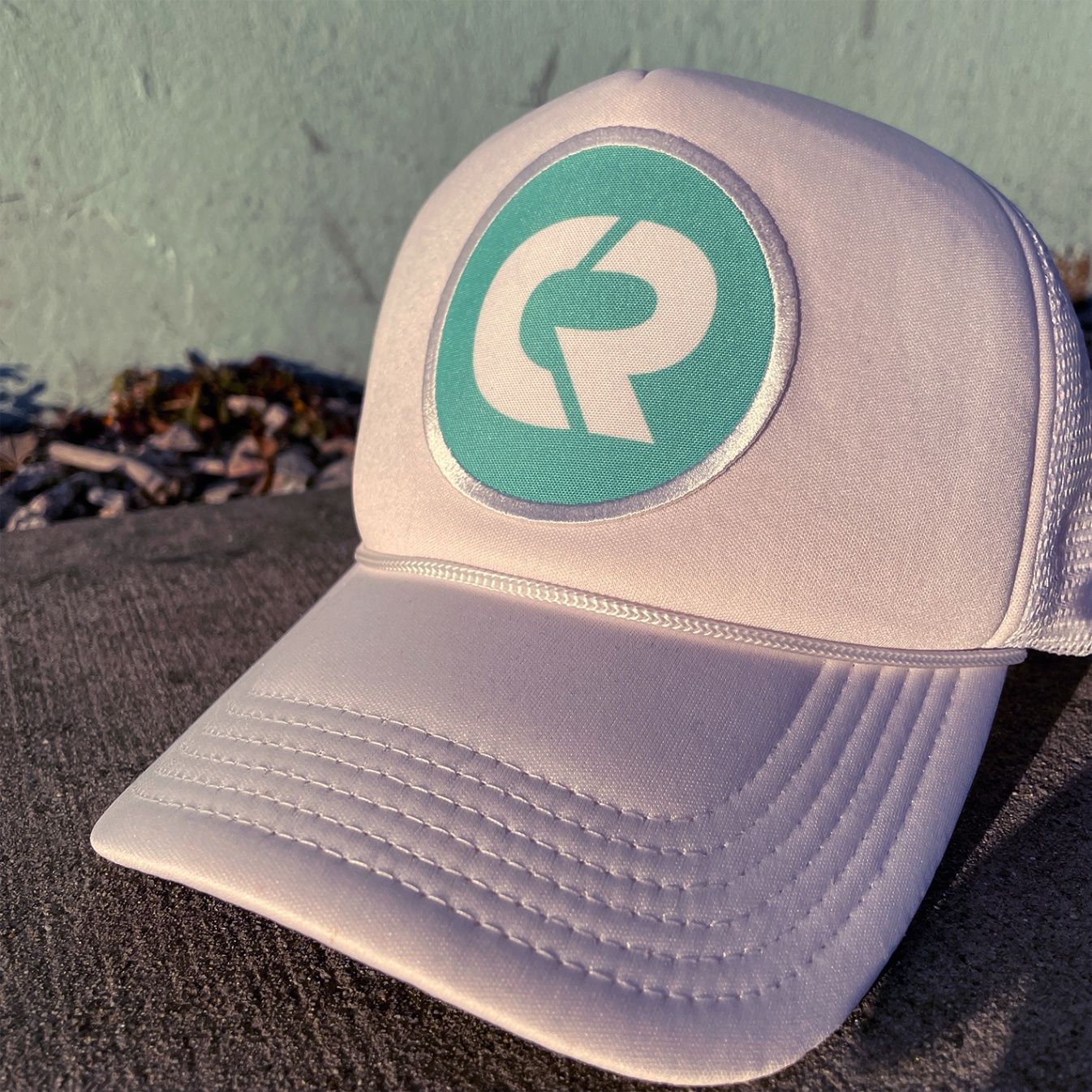 An image of a trucker hat printed with a sublimated patch.
