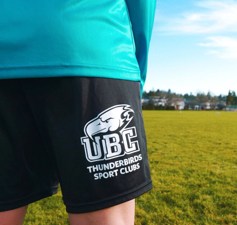 Custom athletic shorts with screen-printed branding for the UBC Thunderbird Sports Club.