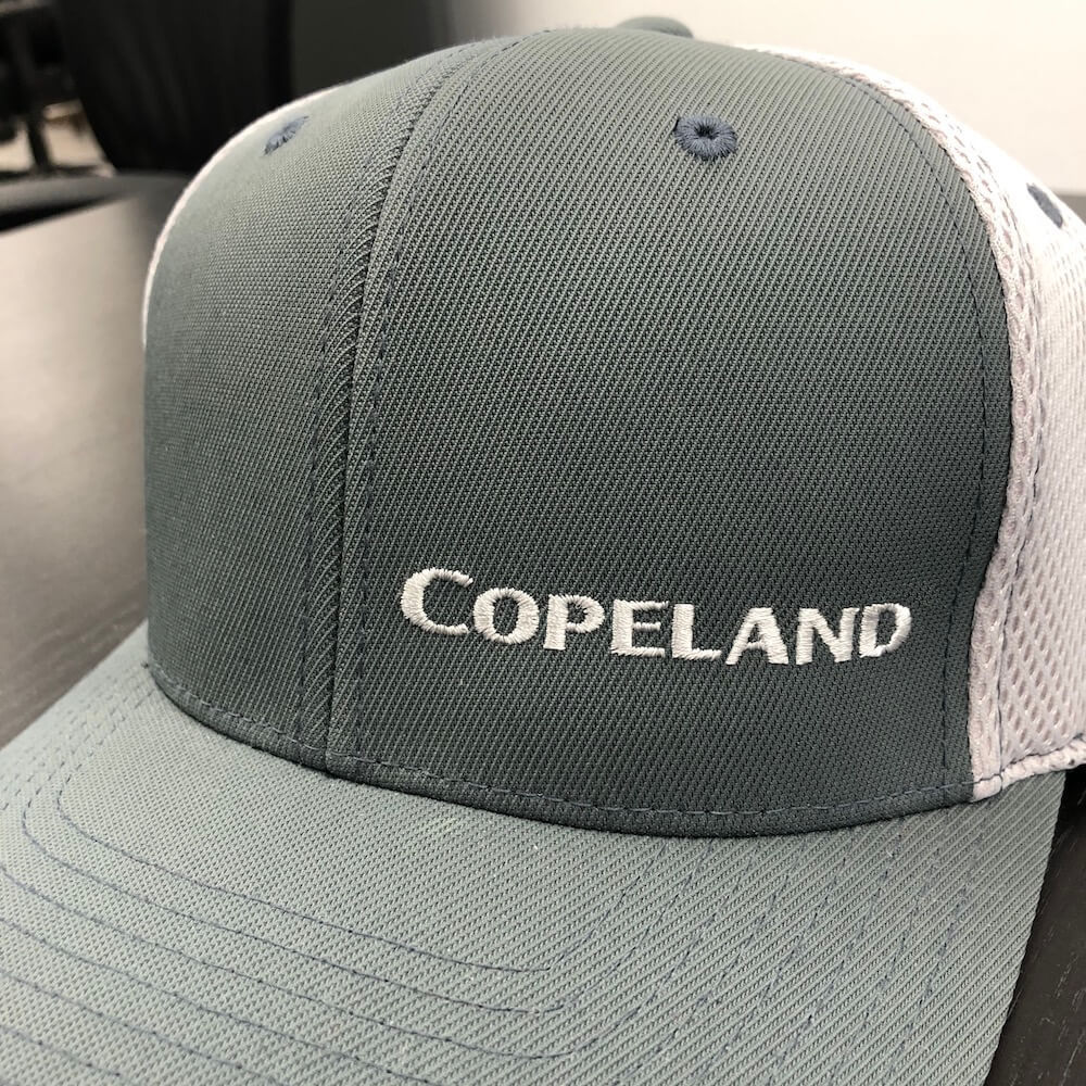 An image of a custom embroidered trucker hat we printed for Copeland