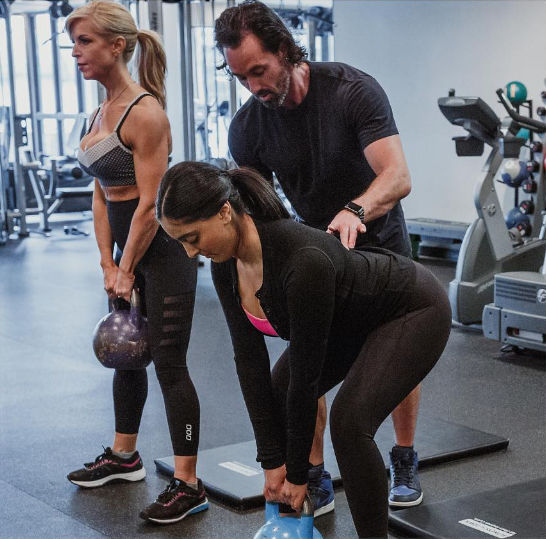 An image of the TurnFit Owner training some clients.