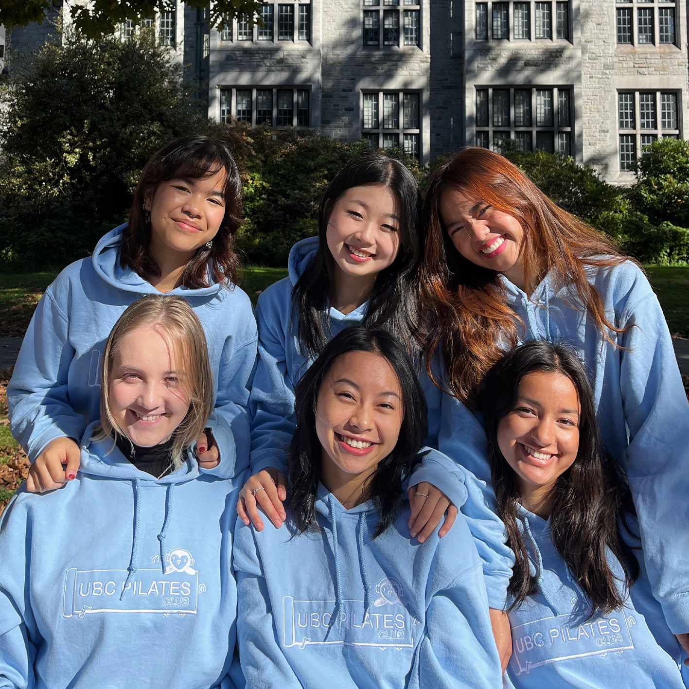 An image of the UBC pilates team wearing hoodies we embroidered.