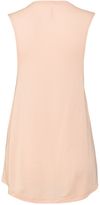 Am image of a Custom Bella and Canvas Ladies' Flowy Scoop Muscle Tank in Peach!