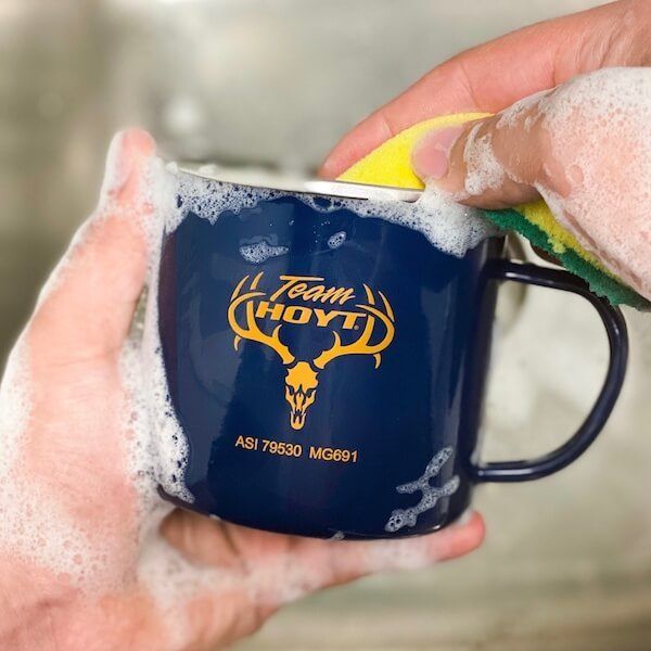 Check out this travel mug screen printed with an orange design.