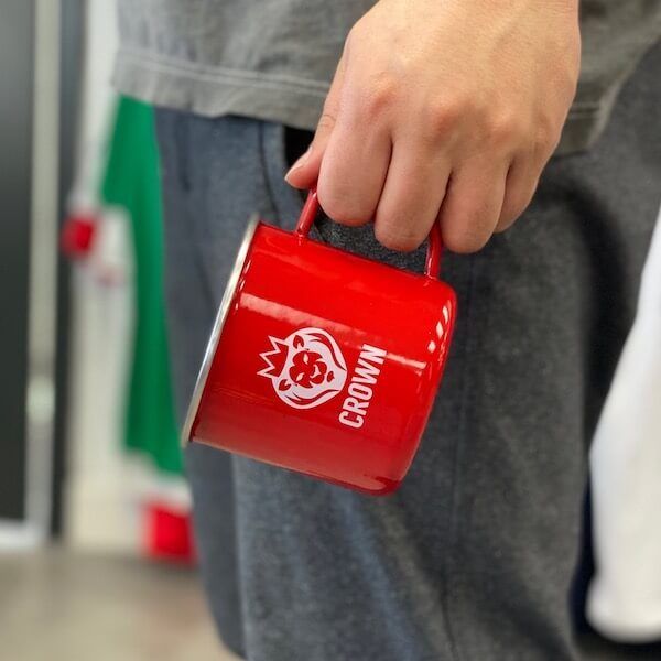 A travel mug printed with a white screen print.
