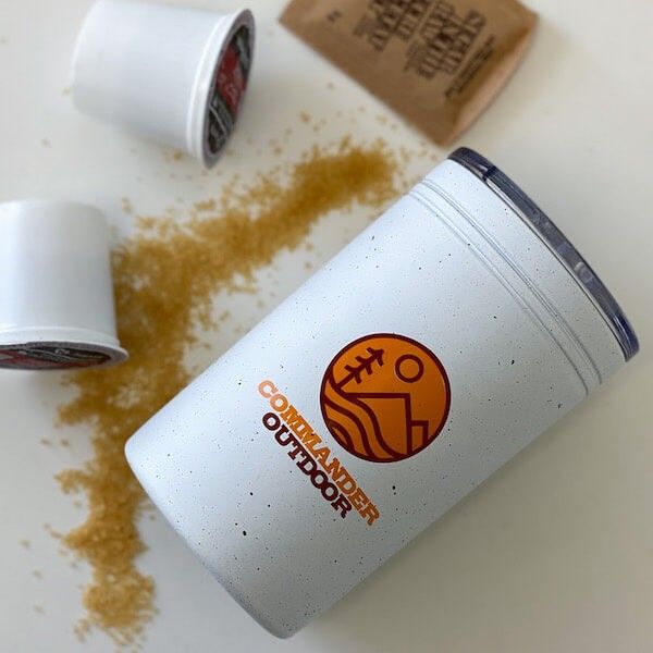 A custom metal tumbler made for hot liquids like coffee.