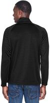 Am image of a Custom Devon & Jones Men's Stretch Tech Shell® Compass Full Zip in Black!