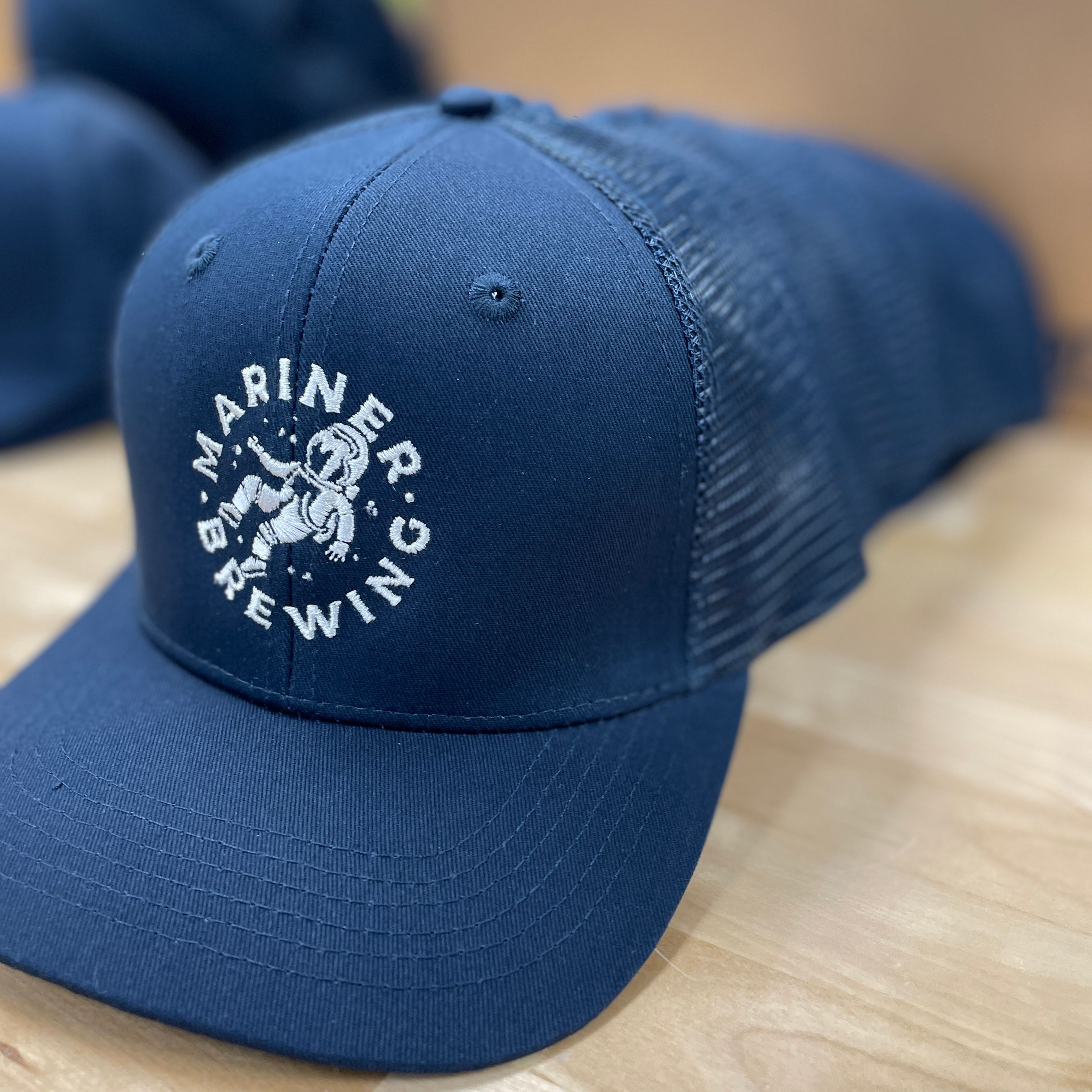 An embroidered trucker hat that we printed for Mariner Brewing.