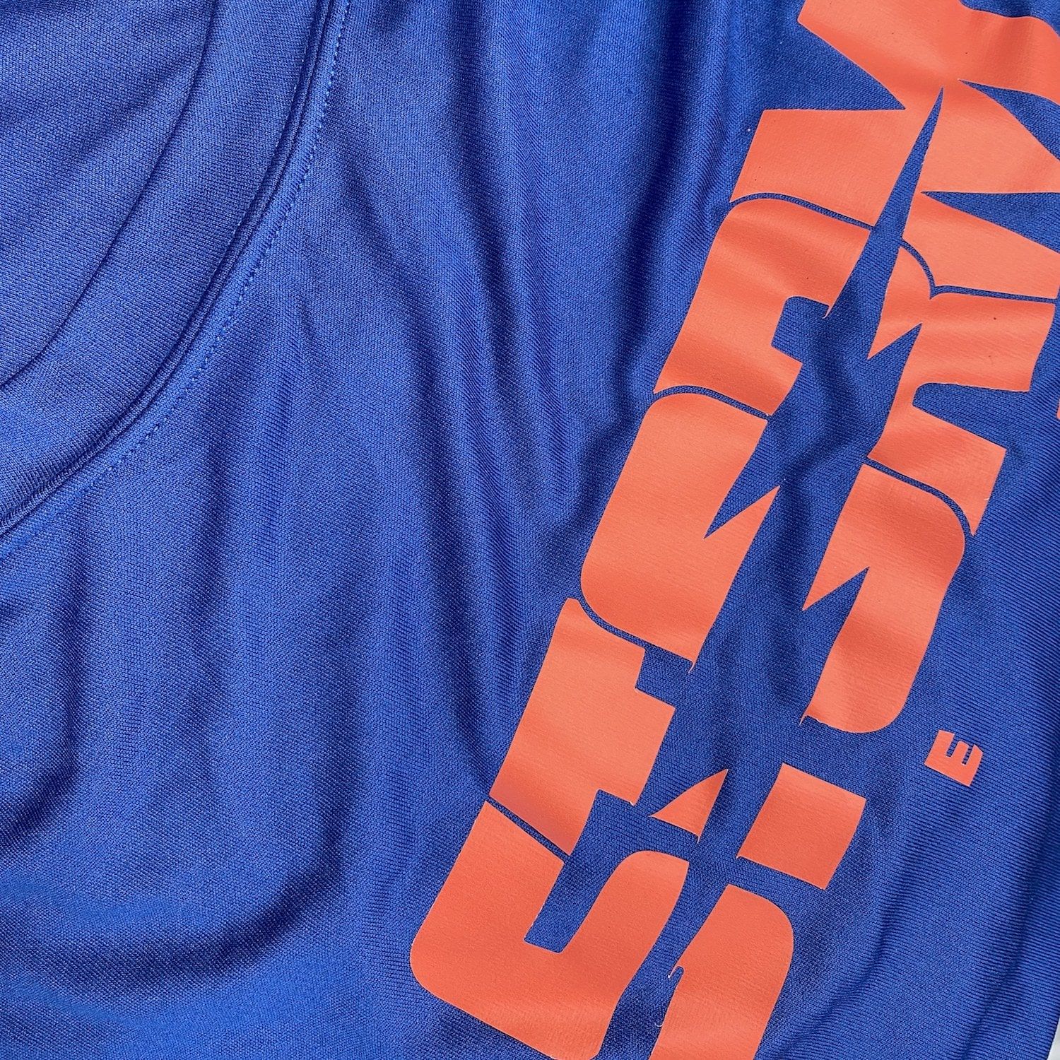 A close up of an athletic t-shirt with a screen printed shirt