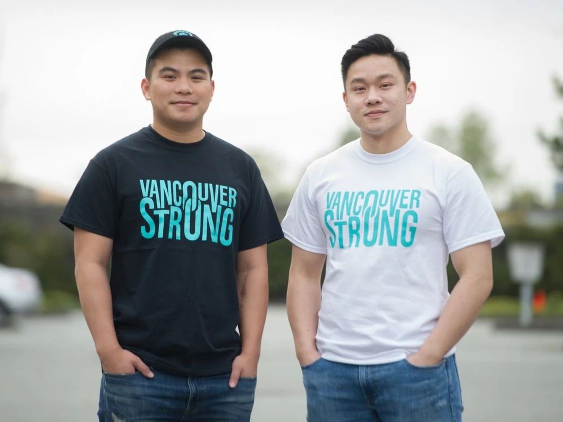 An image of the owners of Coastal Reign wearing the Vancouver Strong merchandise our team created.