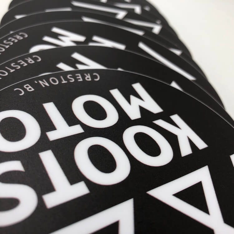 a picture of circular stickers die cut on our printing machine