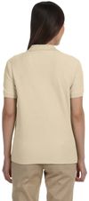 Am image of a Custom Devon & Jones Ladies' Pima Pique Short Sleeve Y Collar Polo in Stone!