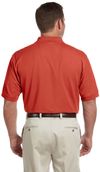 Am image of a Custom Devon and Jones Men's Pima Pique Short Sleeve Polo in Rust!