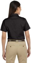 Am image of a Custom Harriton Ladies' Easy Blend Short Sleeve Twill Shirt with Stain Release in Black!