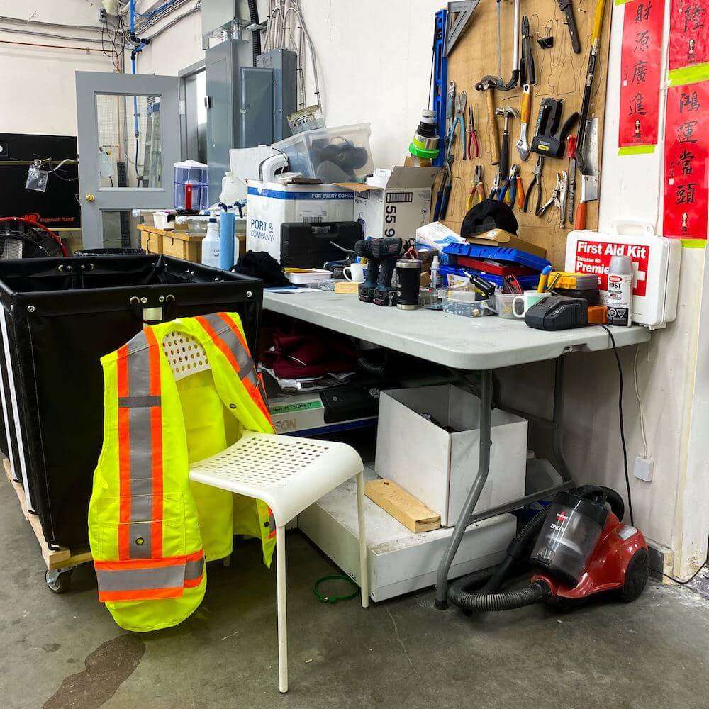 Resting a custom safety vest on a chair during a break.
