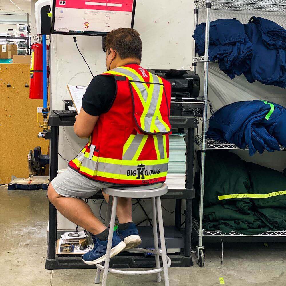 A bright red safety vest perfect for any warehouse environment.