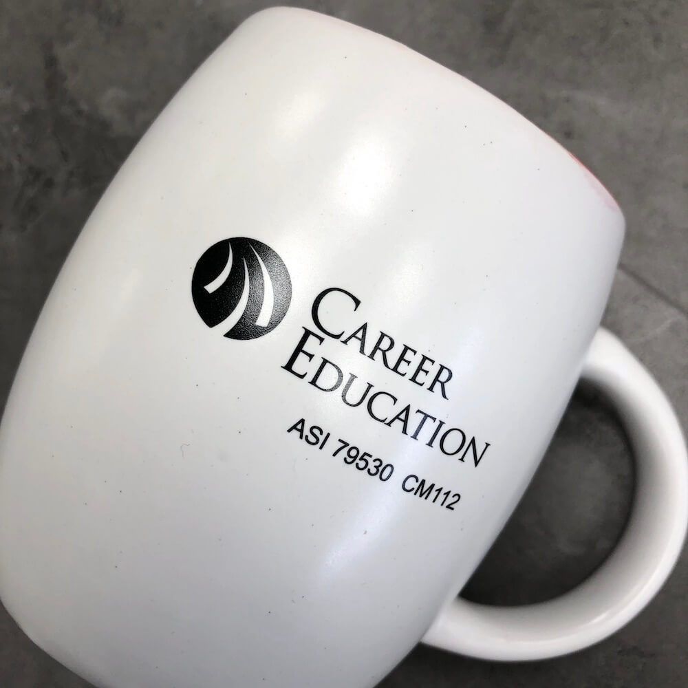 A custom mug that with a black screen printed design