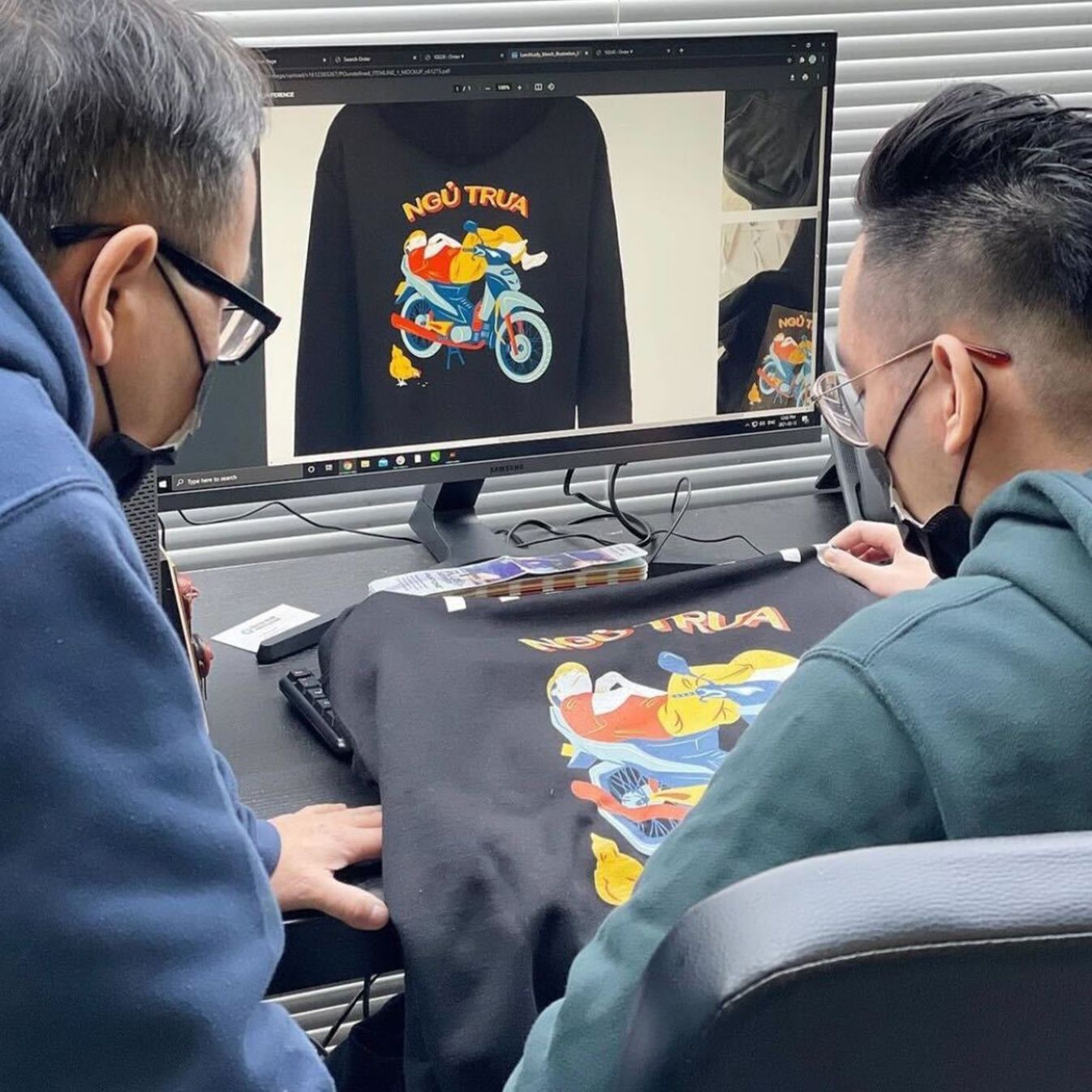 An image of Coastal Reign staff working in the office